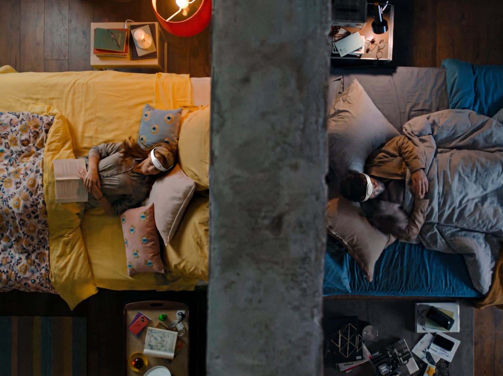 A woman asleep in a bright bedroom, the wearable on her forehead.